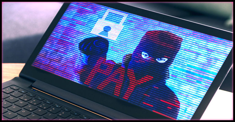 Laptop displaying a ransomware screen: Hacked figure points at the word 'PAY' in red binary text.